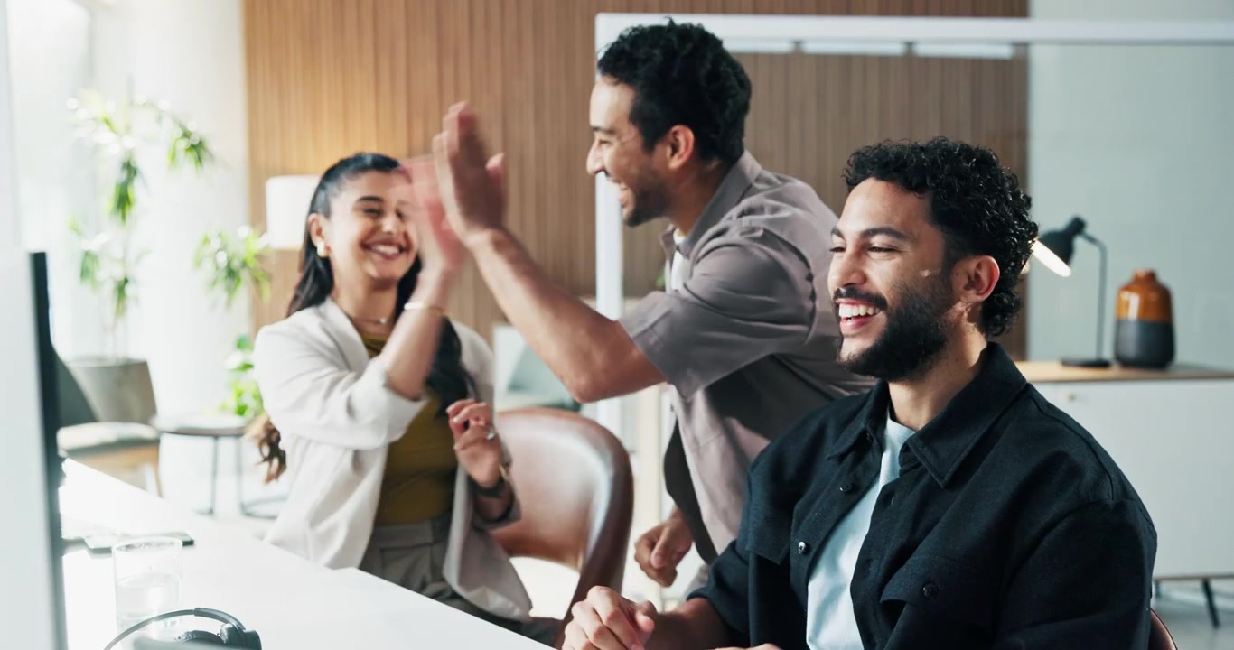 Diverse Team Celebrating Success in Modern Office