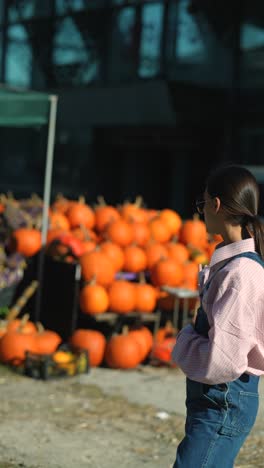 woman at a pumpkin patch