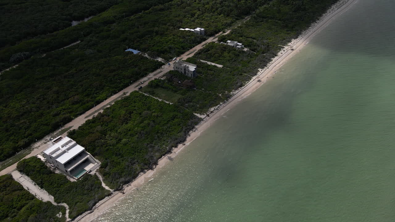 Sisal Aerial View 4K Empty Yucatan Beach On Mexican coast showing Sisal growth