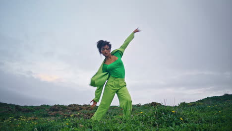 talented dancer performing cloudy nature. girl jumping dancing field vertically