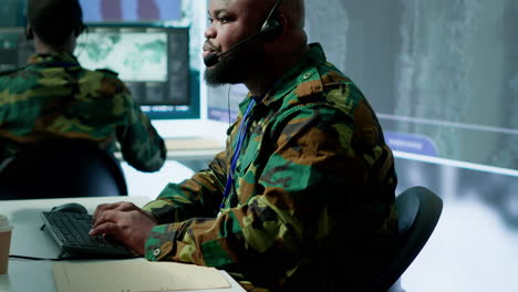 military control room features army personnel monitoring surveillance systems