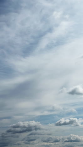 Transformation of the clouds in the atmosphere. Beautiful sky covered by cloudscape. Timelapse. Vertical video.
