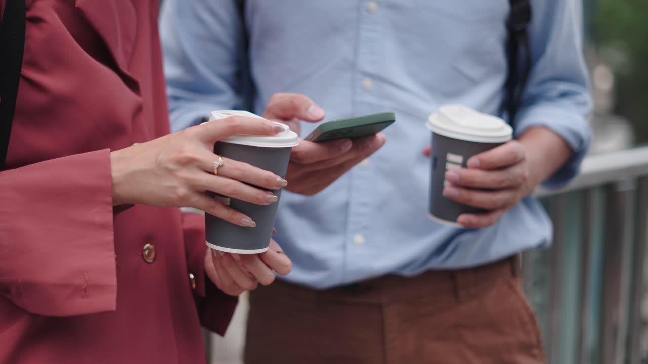 Business People Having Coffee and Using Phones
