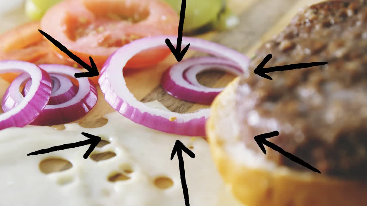Animazione di un hamburger con telecamera che si sposta a destra, panino che entra e si sistema, e frecce che evidenziano i condimenti
