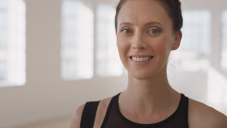 yoga class portrait happy pregnant caucasian woman smiling holding belly enjoying healthy lifestyle in fitness studio