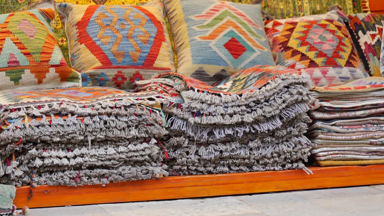 Colorful Turkish carpets and cushions for sale