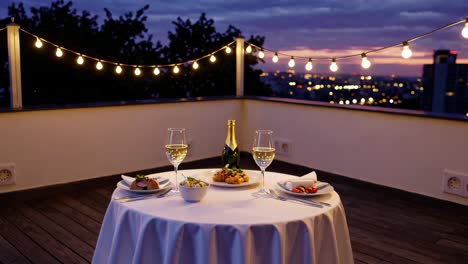 romantic rooftop dinner at sunset