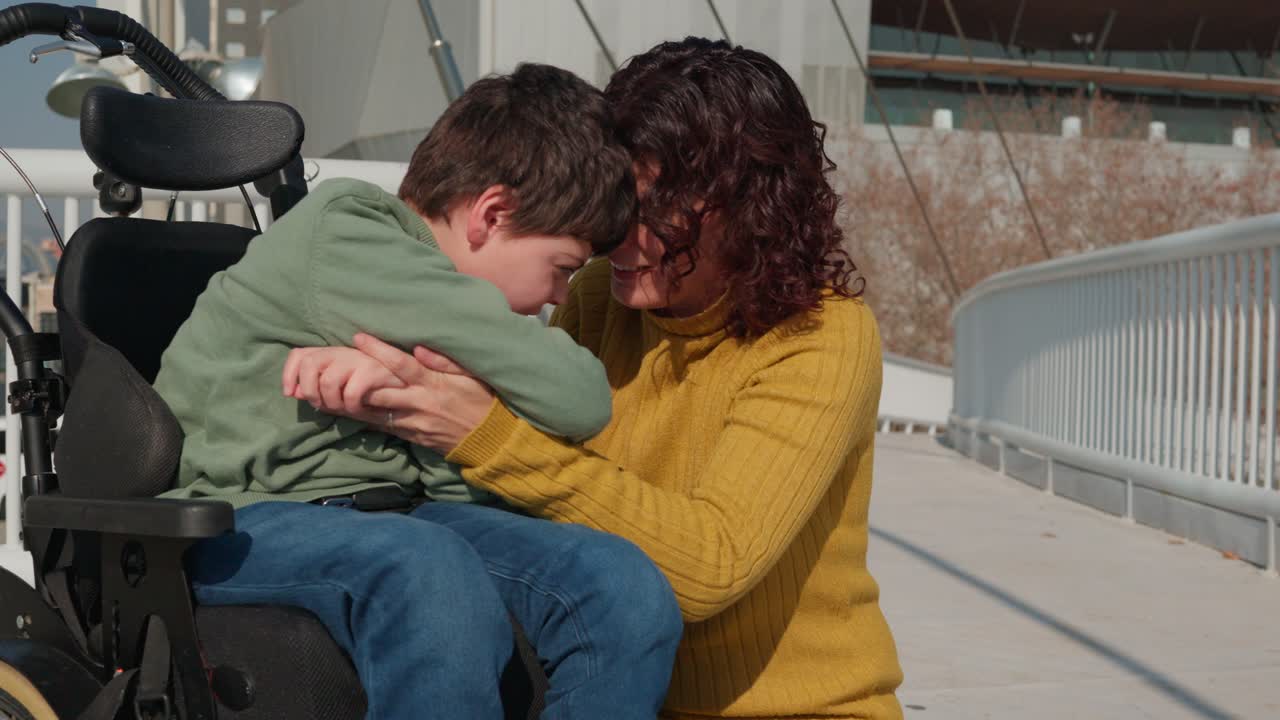 Affectionate moment between mother and child in wheelchair