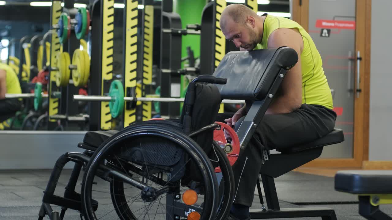 Man with disabilities training in the gym of rehabilitation center