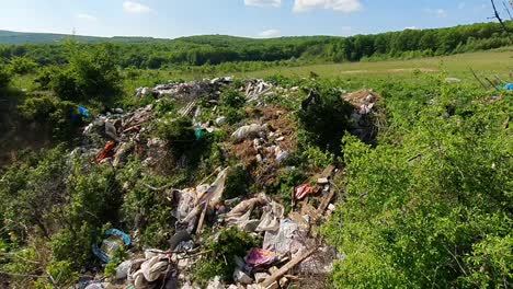 a landfill with rubbish in the middle of nature in romania