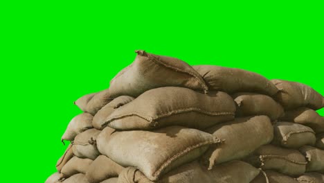 sandbags-for-flood-defense-or-military-use-on-green-chromakey-background