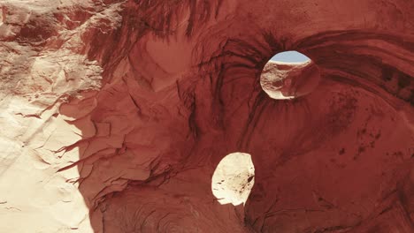 the beauty of cave eyes in the iconic monument valley, utah. explore the intricate natural rock formations of the cave as they blend seamlessly with the surrounding stunning desert landscape.