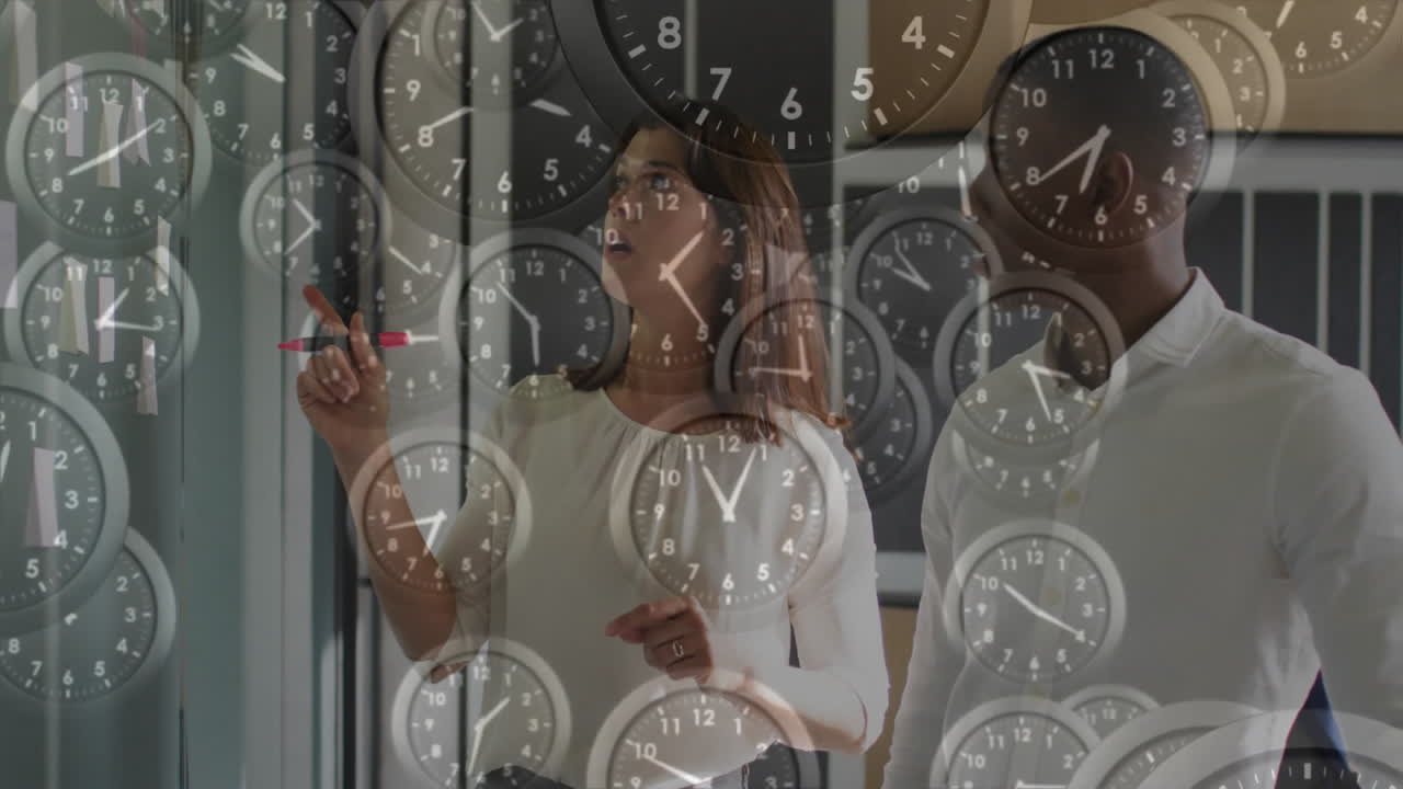 Animation of moving clocks over diverse colleagues brainstorming in office