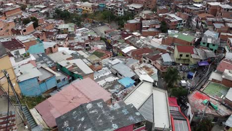 Aerial-retreats-from-urban-favela-basketball-court-to-hillside-homes