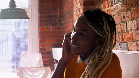 Female-executive-talking-on-mobile-phone