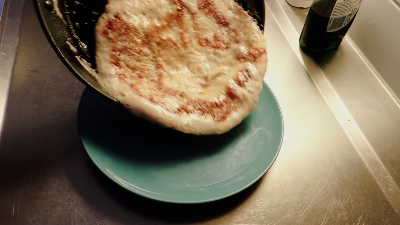 Omelet is Flipped from Pan to Plate - Steady Shot