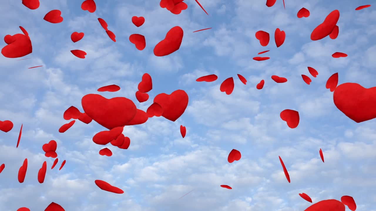 Red hearts falling down in the blue sky