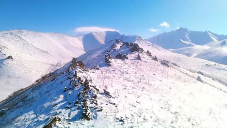 Rocks-in-winter-filmed-from-a-drone-in-sunny-weather-4k