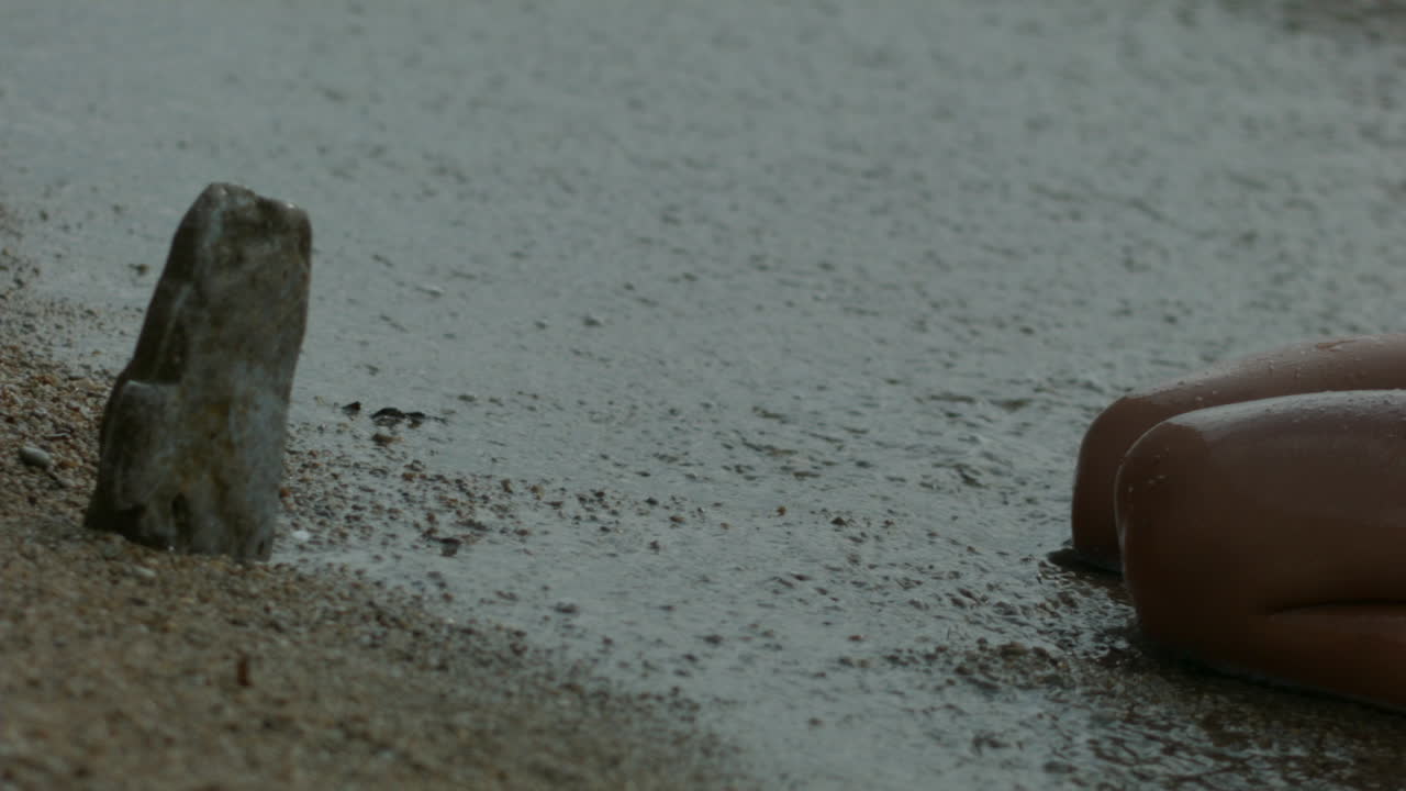 Child playing in the waves on the beach