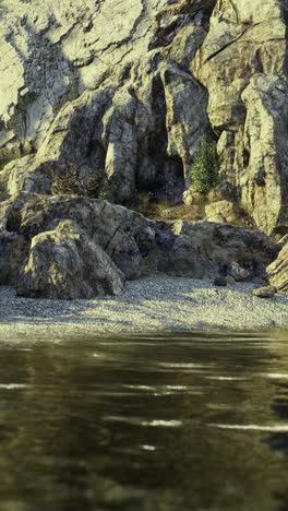 rocky coastline with water reflections and natural landscape in calm conditions