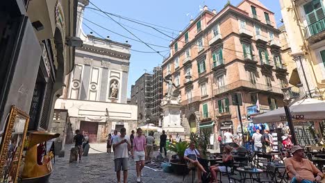 people walking and dining in naples street