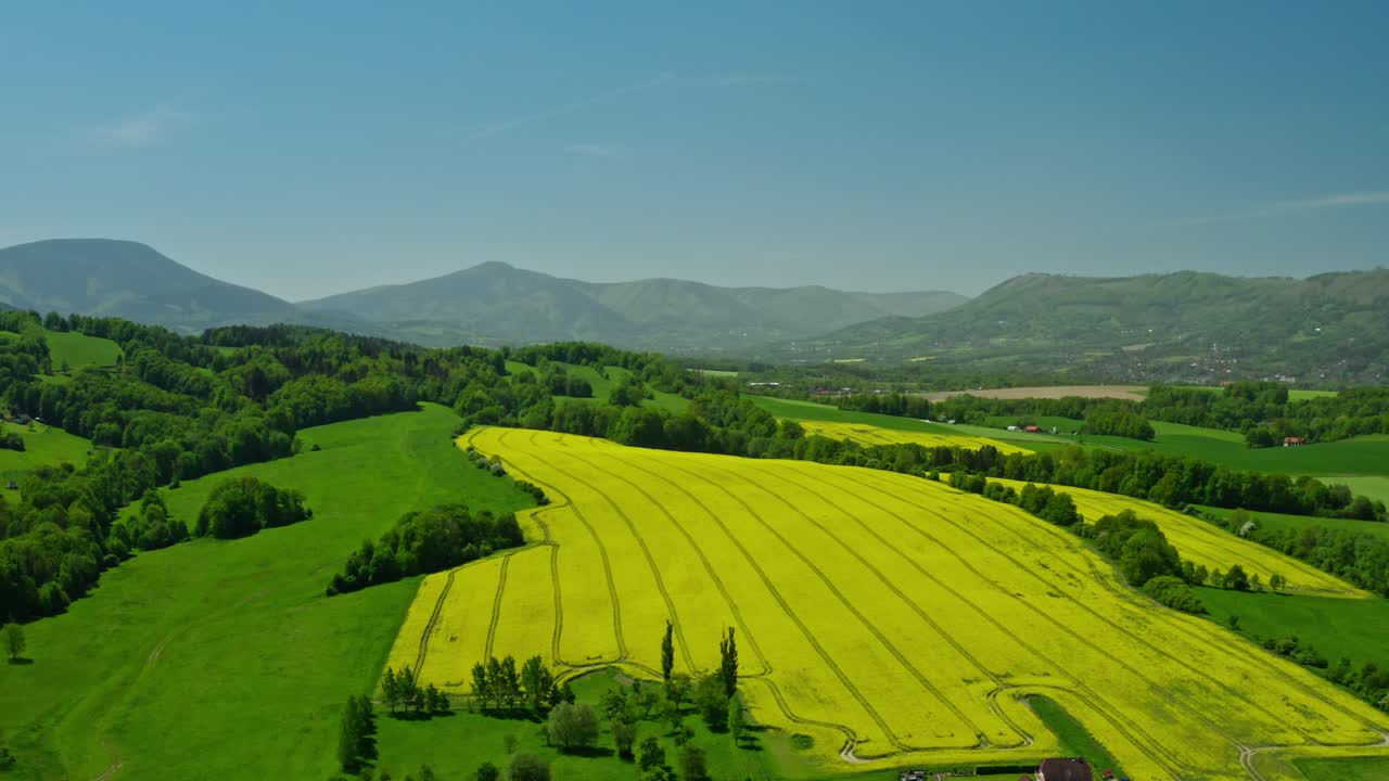 Aerial side drone shot of czech beskydy mountains landscape with fields