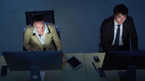 top veiw and pan video shot of call center to provide customer service 24 hours a day, call center staff are also willing to service, will be at night