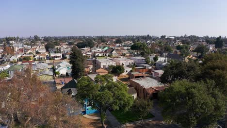 aerial rising and panning shot of a south la neighborhood