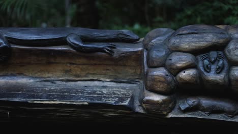 detailed wooden carving in a forest environment