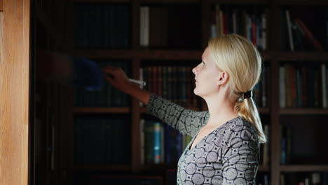 Librarian-Dusting-Bookshelf