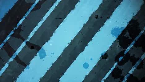 animación de rayas grises de pintura sobre un fondo azul