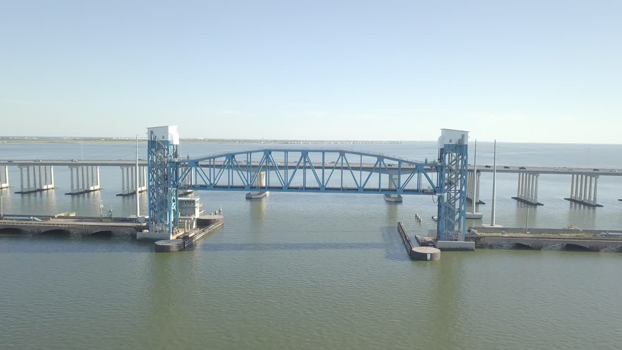 Establishing Drone Shoot of Galveston old Causeway Blue Galveston Old Highway 75 Bridge Drone Shoot. Aerial shot of the The George and Cynthia Mitchell Memorial. Orbiting Drone Shoot