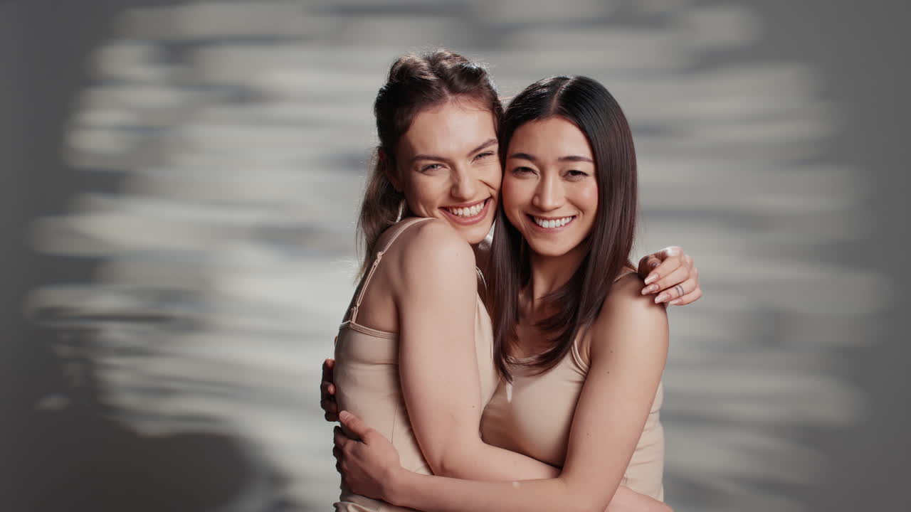 Two Women Embracing and Smiling