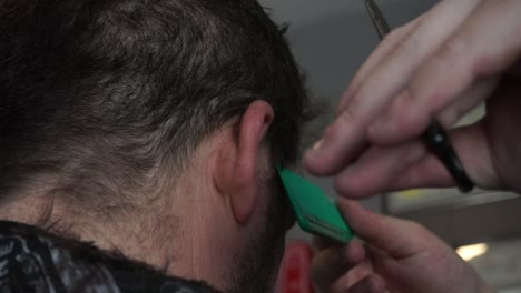 sideview of haircut, closeup, scissors - comb