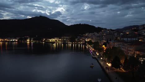 Kastoria,-Greece-by-Night:-Aerial-Views-of-the-Tranquil-Lake-and-Historic-City---Mesmerizing-4K-Drone-Footage