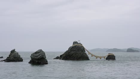 wide shot of meoto iwa, husband and wife rock on coast of mie japan 4k