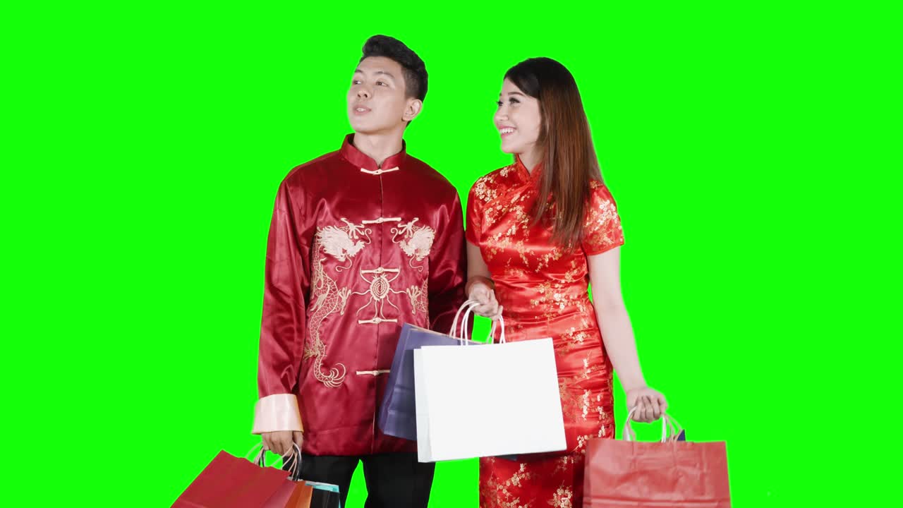 Couple with shopping bags and cheongsam dress