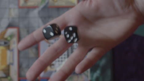 slow motion - hand throwing and catching dice