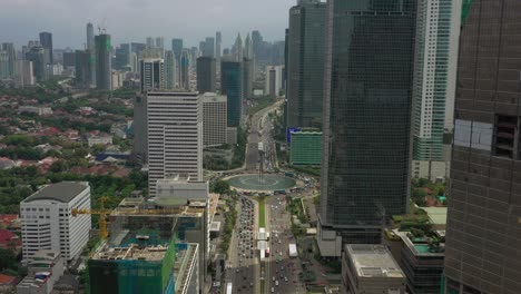 hora del día de verano ciudad de jakarta área del centro del tráfico círculo de la calle panorama aéreo 4k indonesia