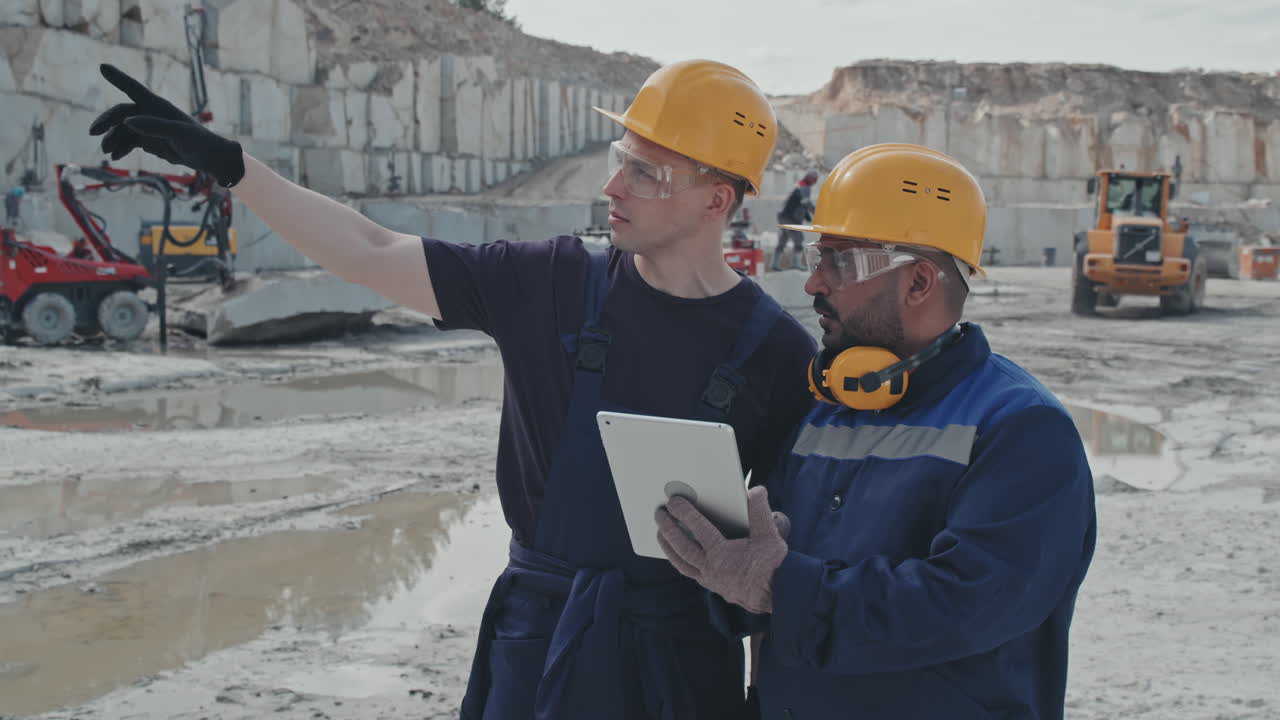 Men with Tablet Working in Quarry