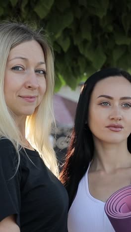 two beautiful sports girls are looking into the camera lens morning fitness training two beautiful sports girls are looking into the camera lens morning fitness training portrait slow motion