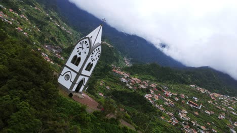 a picturesque chapel amidst lush greenery and mountain backdrop in madeira