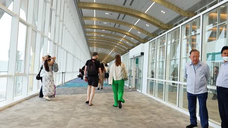 airport terminal corridor with passengers