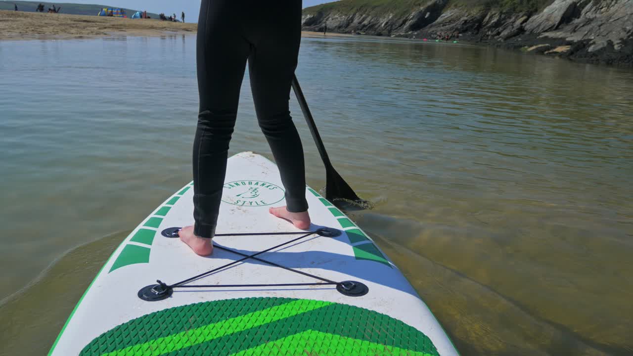 Young girl paddleboarding using awe 1