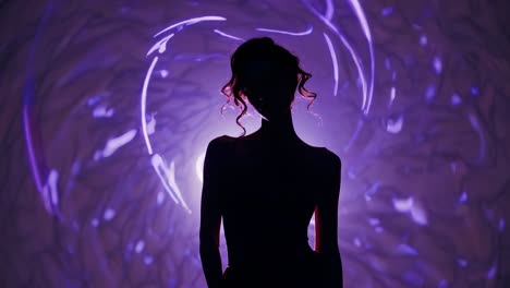 silhouette of a woman in purple light