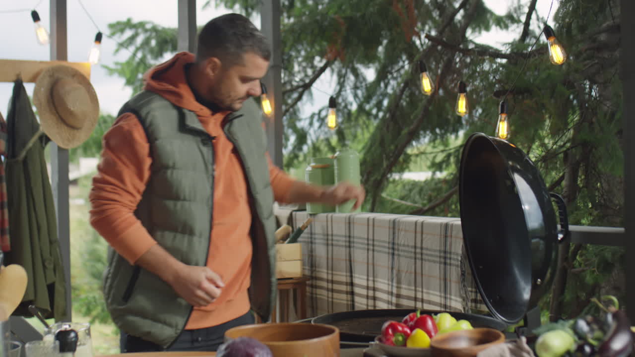 Food Blogger Giving BBQ Masterclass on Outdoor Terrace