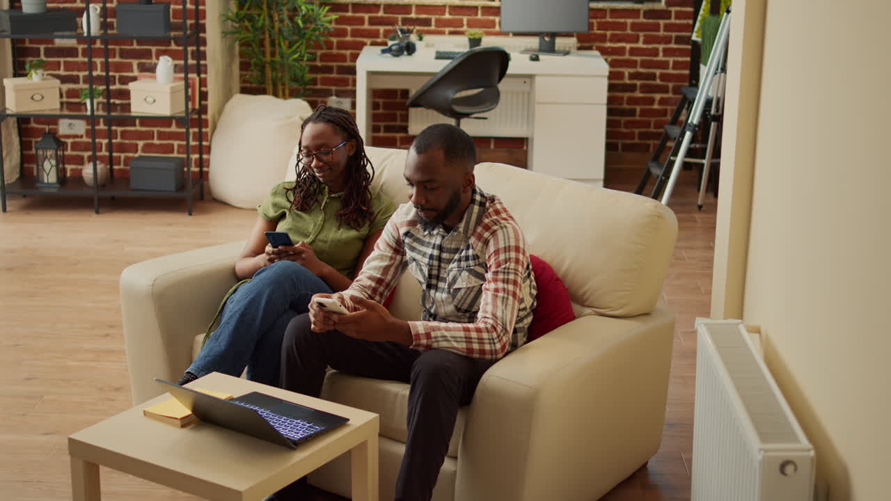 Young partners in love being comfortable sitting at home