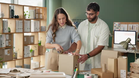 couple packaging boxes for their small business