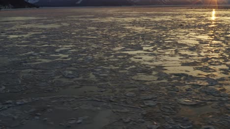 Best-cinematic-aerial-footage-of-Cook-Inlet-during-sunrise-peaking-over-mountain