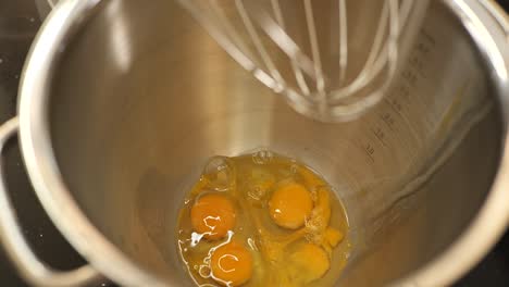 combining eggs and sugar while baking